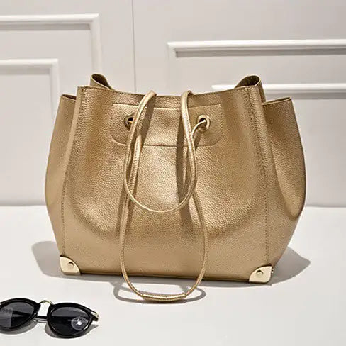 Class Appeal Handbags In Gold, Platinum And Classic Black